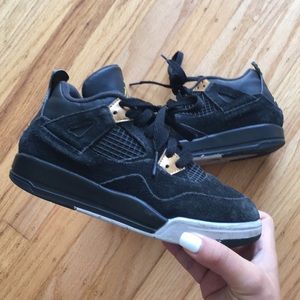 Little boys black and gold Jordan’s size 1.5Y